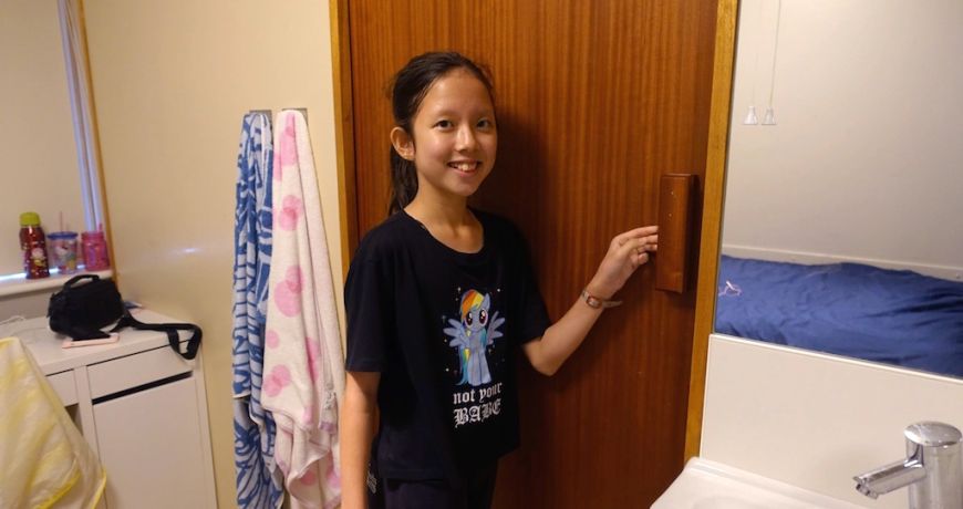 Young pupil inside her bedroom at ECS residential English summer boarding school