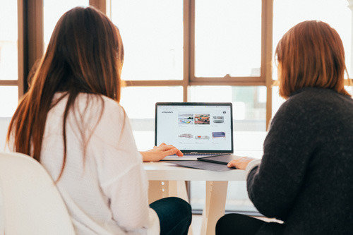 Two teens at online English lesson